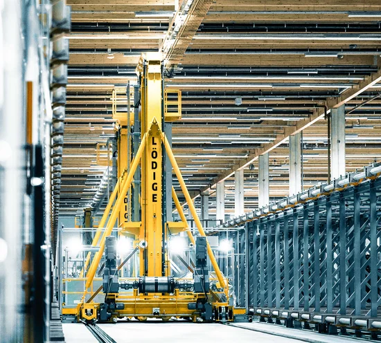 Elevating Transfer Vehicle (ETV) operating in an automated storage system, handling and transferring ULDs efficiently across multiple levels.